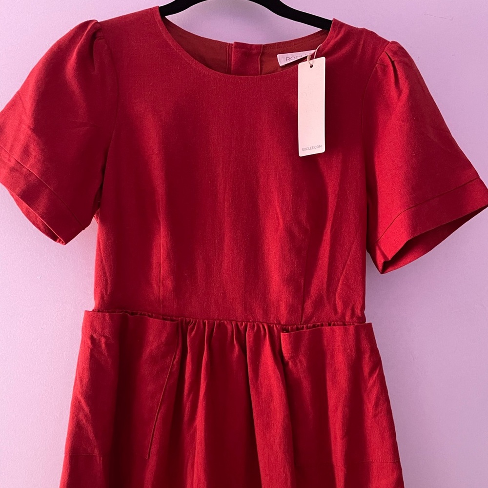 Burnt orange/red knee length dress. Designer-Roolee